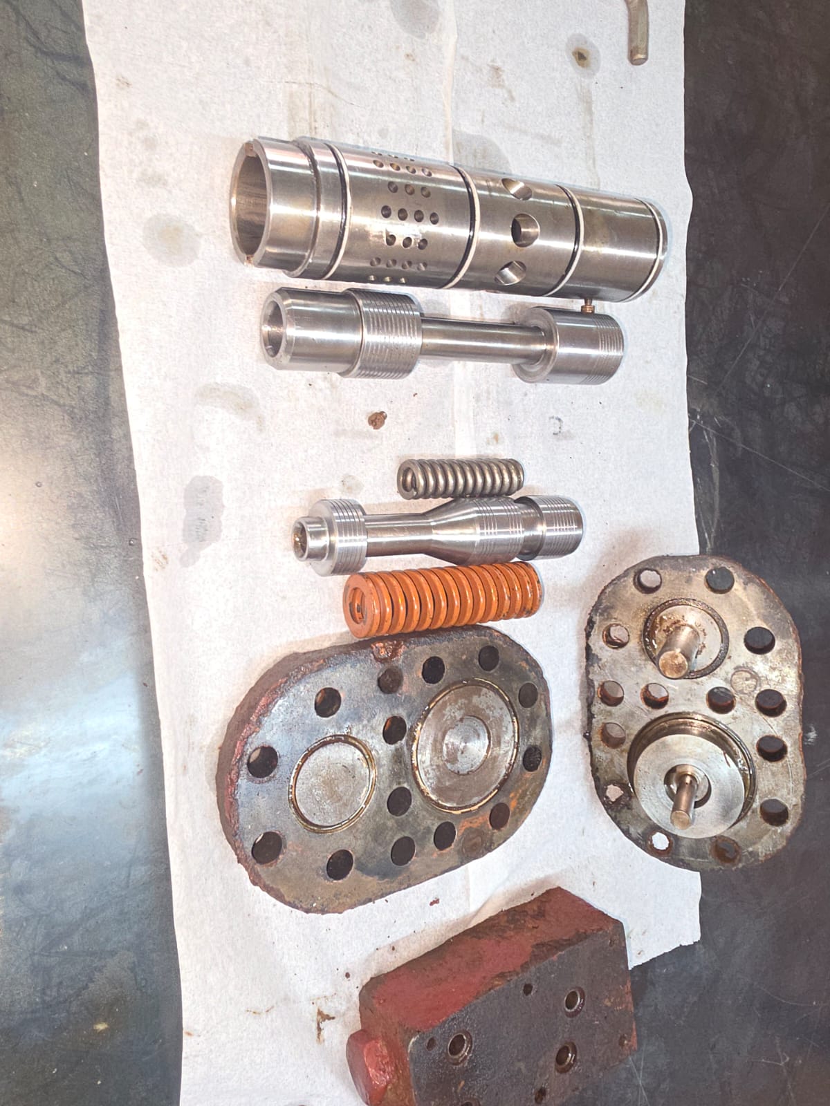 Hydraulic valve components and springs laid out for inspection