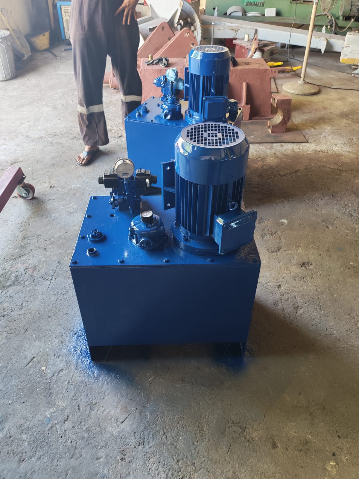 Blue hydraulic power packs in the workshop