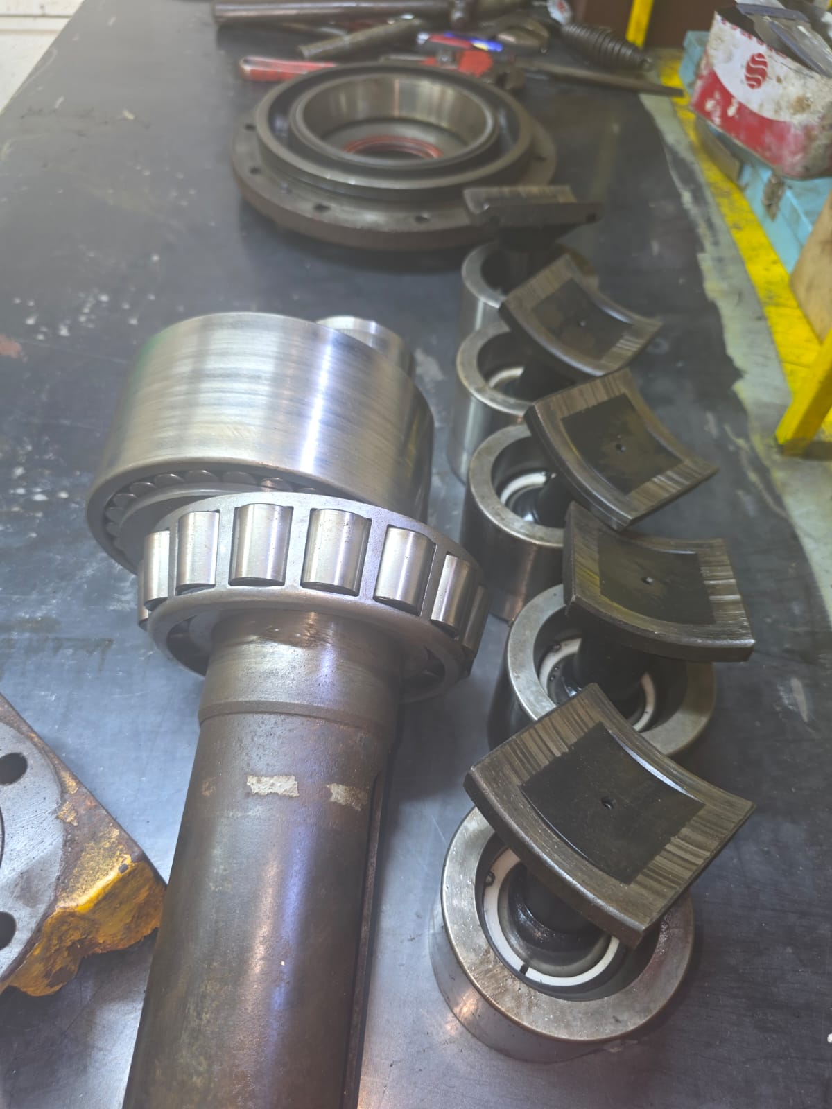 Disassembled windlass hydraulic motor components on a workbench